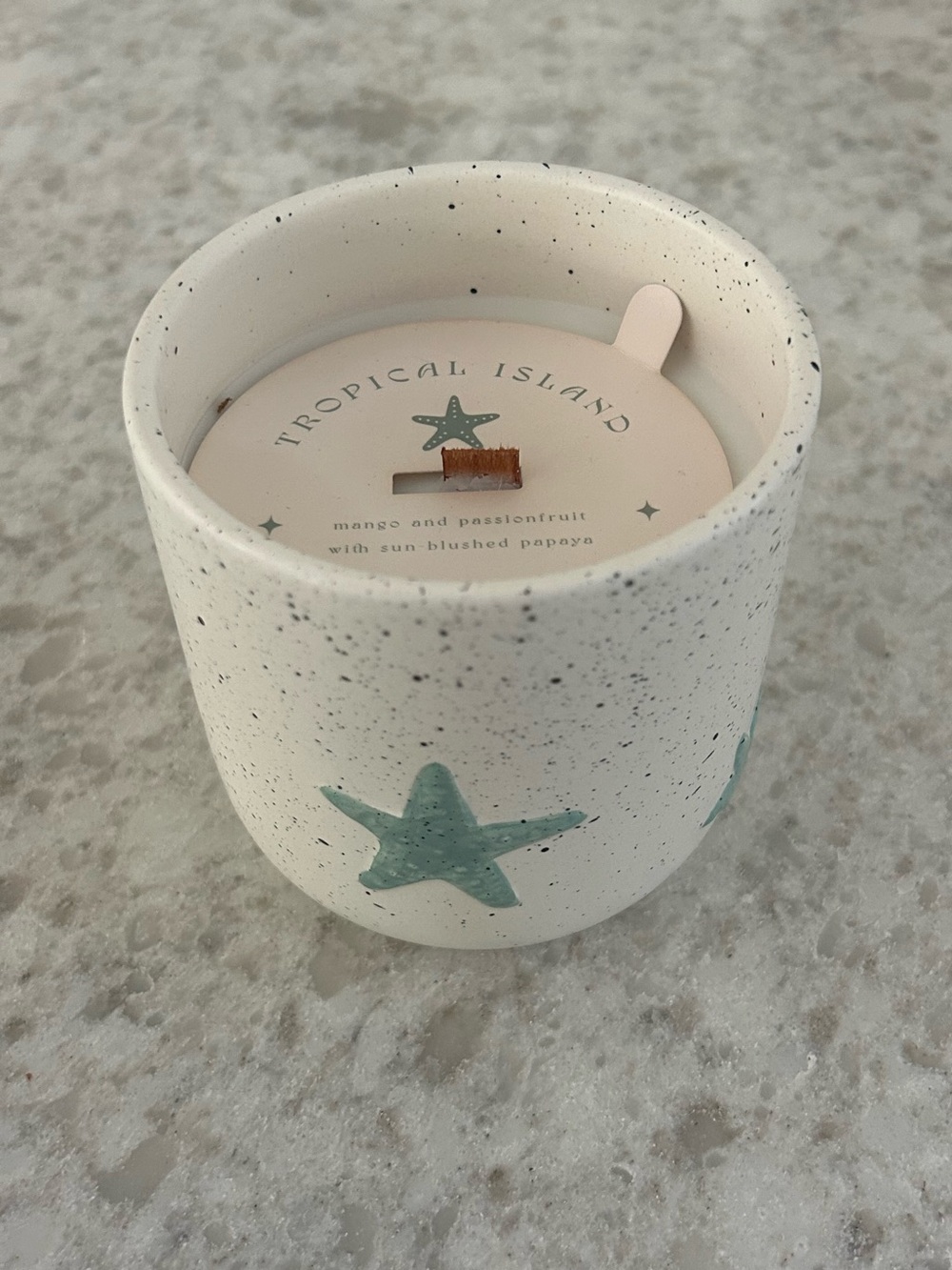 “New” DW Home White Speckled Ceramic 13.3 oz Candle with Teal Starfish Accents